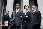 Low angle view of lawyers in front of a courthouse