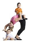 Contortionist mother with son and baby daughter