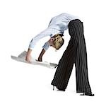 Female contortionist businesswoman bending over backwards