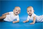 Identical twin babies crawling