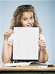 Schoolgirl holding A plus paper