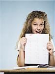 Schoolgirl holding A plus paper