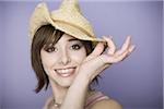 Portrait of a teenage girl wearing a straw hat