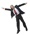 Portrait of a businessman jumping with his arms outstretched