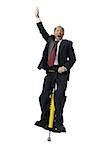 Portrait of a businessman on a pogo stick