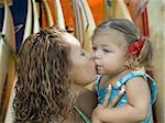 Close-up of a mother kissing her daughter