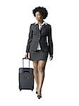 Close-up of a businesswoman walking with luggage