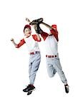 Two baseball players jumping