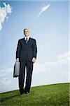 Low angle view of a businessman holding a briefcase