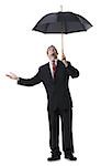 Businessman holding an umbrella and looking up