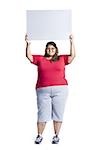 Heavyset young woman holding blank sign