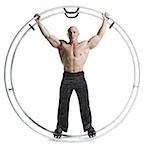 Male bodybuilder posing in German wheel