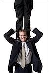 Businessman supporting colleague on shoulders