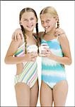 Young sisters in swimsuits on vacation