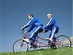 Couple riding on a tandem bicycle