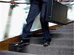 Businessman walking down stairs