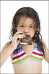 Young girl eating ice cream snack
