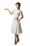 Woman in white dress gesturing