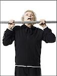 Older woman doing pull up exercises