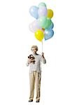 Older woman holding balloons