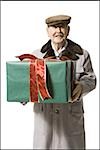 Older man holding present