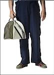 Male bowler holding a bowling bag