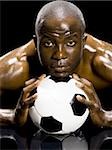 Athlete posing with soccer ball