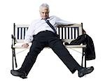 Businessman sleeping on a bench