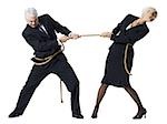 Businessman and businesswoman in a tug of war