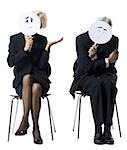 Businessman and businesswoman holding expression masks