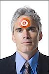 Man with bull's-eye on forehead