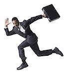 Businessman running with briefcase