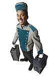 Bellboy with luggage smiling