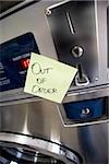 Out of order sign on Laundromat machine