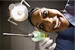 Dental hygienist with syringe dramatic angle