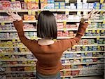 Rear view of woman in medicine aisle