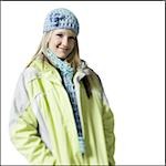 Teenage girl with hat and scarf smiling