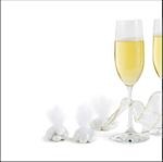 Two champagne flutes with champagne and ribbons with hard candies