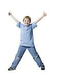 Boy standing with thumbs up smiling