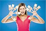 Woman with ten mousetraps on fingers and thumbs