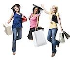 Three women with shopping bags smiling and leaping