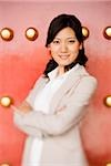 Businesswoman standing with arms crossed smiling