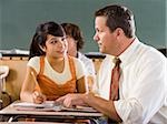 Student and teacher in a classroom.