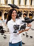 Woman with birds on her shoulder.