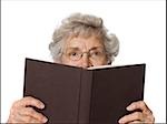 Senior woman reading a book.