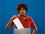 young man casting a ballot.