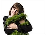 businessperson holding a patch of grass