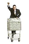 businessperson with a shopping cart full of money