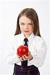 Girl in School Uniform Holding Apple