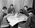 1960s THREE GENERATION FAMILY SAYING GRACE PRAYER AT THANKSGIVING TURKEY DINNER